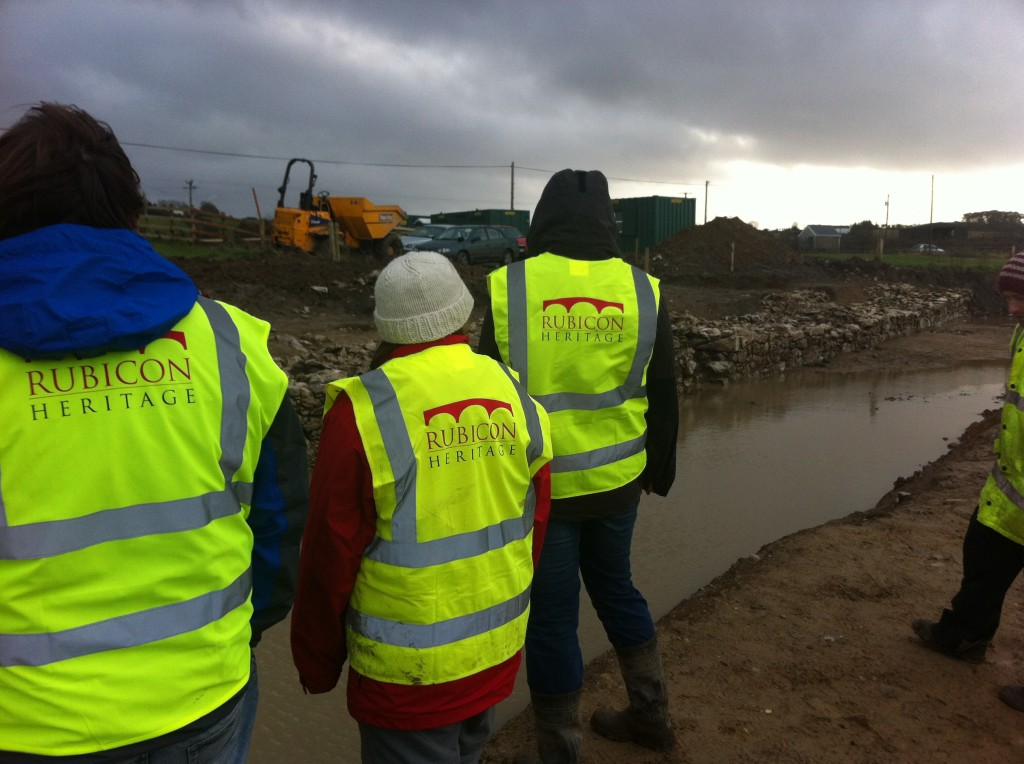 The team gaze nervously over the waterfilled moat and revetment...